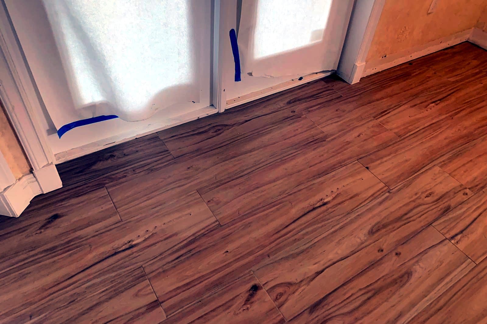 Room with French doors: Wood-look porcelain tile