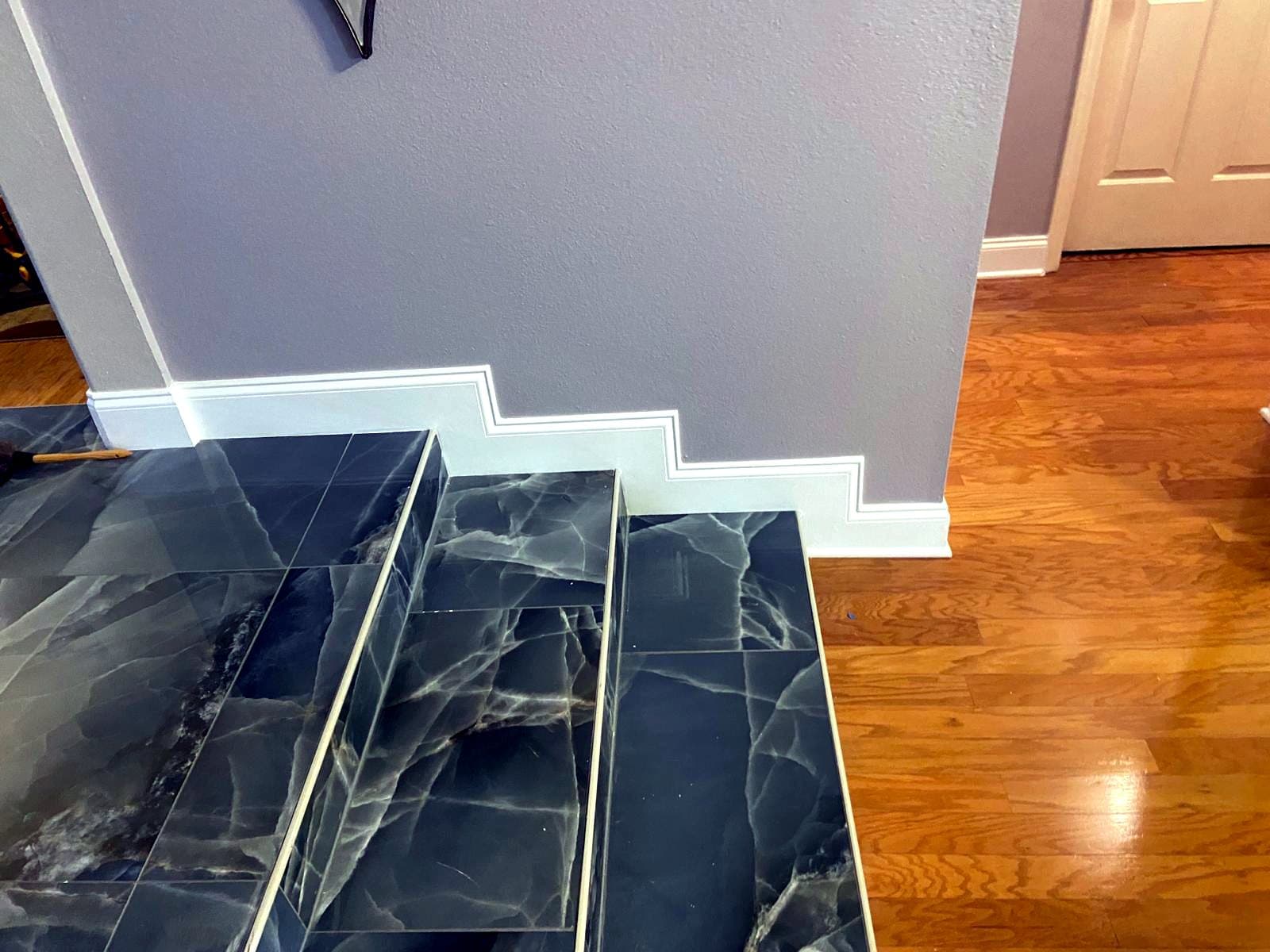 Marble-look stairs: Marble-look tile on stairs