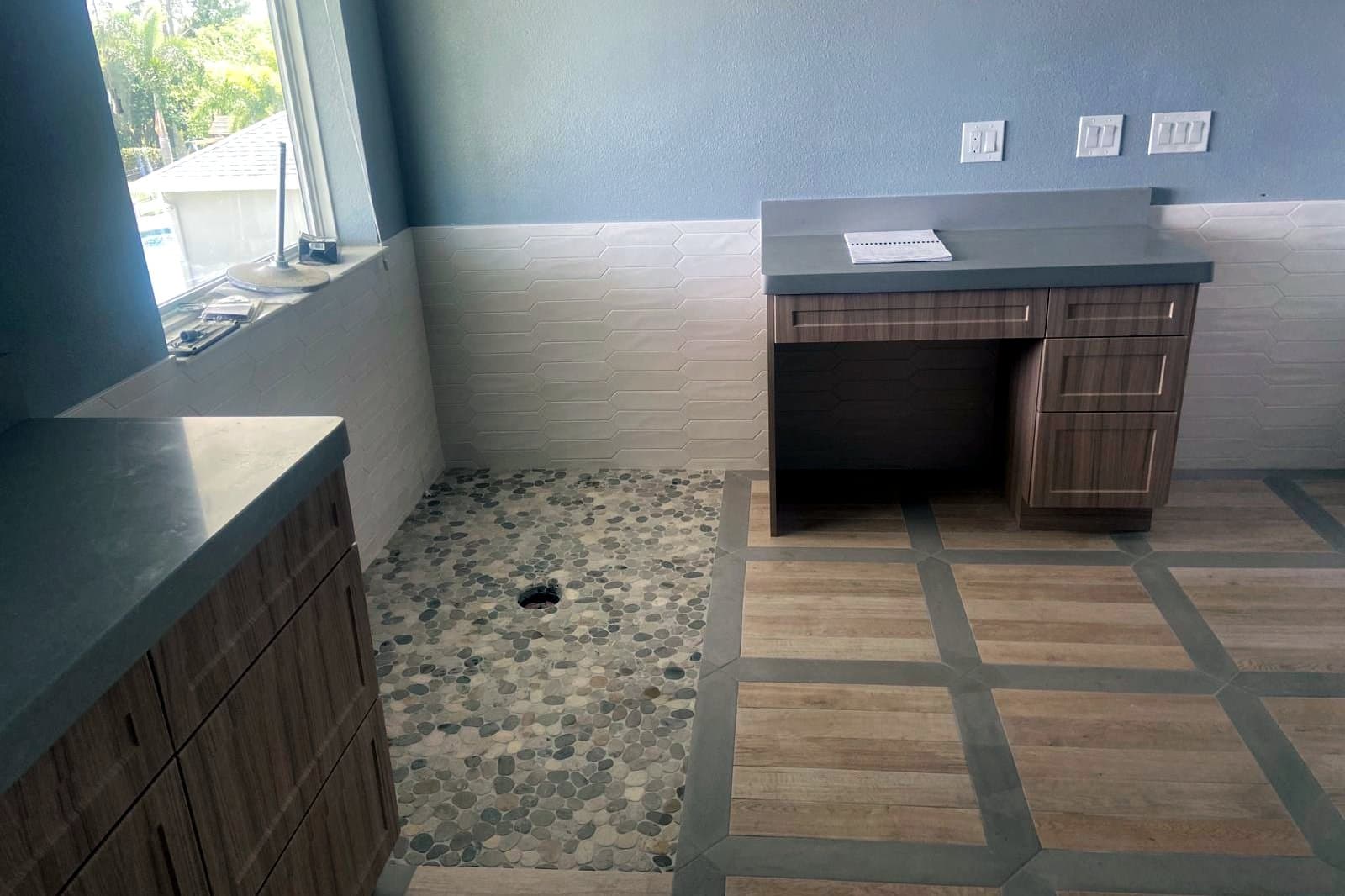 Bathroom with patterned tile: Wood-look tile with a grey border pattern