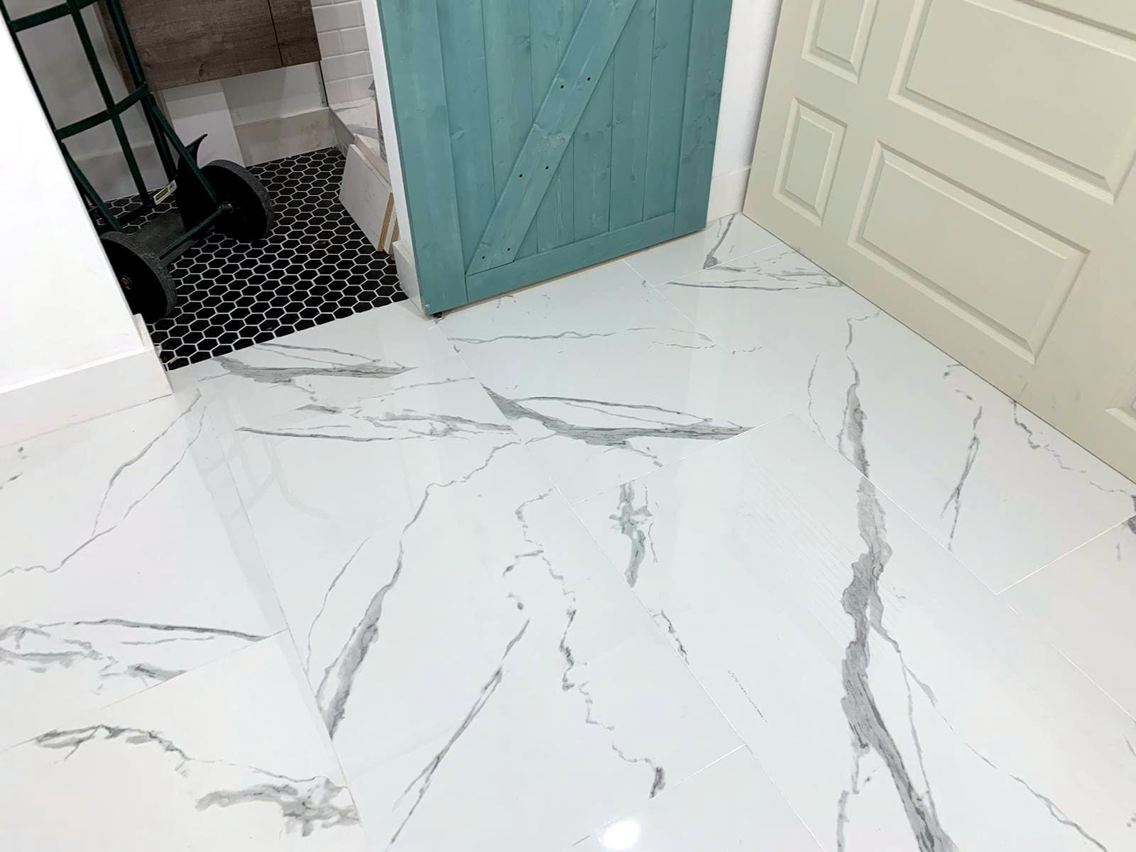 White marble-look bathroom and entry: Marble-look porcelain tile, photo 2