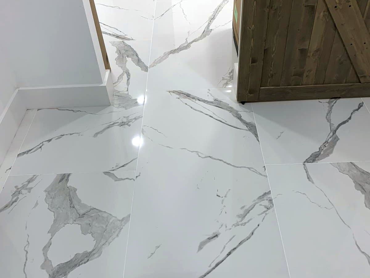 White marble-look bathroom and entry: Marble-look porcelain tile, photo 5